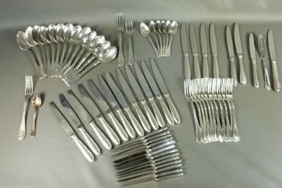 many forks and spoons laid out on a table