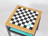 a small table with a chess board on top of it