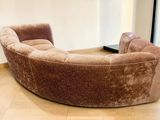 a couch that is sitting on a hard wood floor