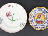 two plates with a picture of a woman and a flower on them