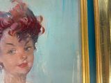painting of a woman with red hair in a gold frame
