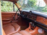 dashboard of an old car with leather seats and dashboard controls