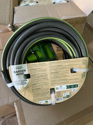 boxes of garden hoses are stacked on top of each other