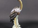 a statue of a bird that is sitting on a table
