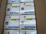 several boxes of saniti soap sitting on top of each other