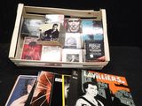 a lot of dvds in a box on a table