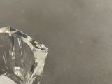 a clear glass vase sitting on top of a table