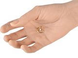 a person holding a ring in their hand on a white background