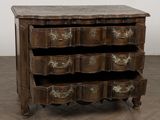 a wooden chest of drawers with many drawers on it