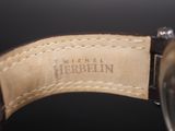 an image of a close up of a watch with a leather strap