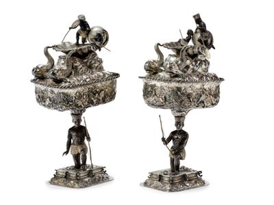 pair of silver plated figurines of a man and a woman with a basket