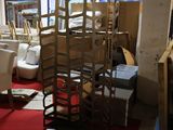 many chairs and tables in a room with a red carpet
