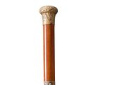 an old wooden walking stick with a metal handle on a white background