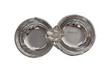 a silver plate with a flower on it on a white background