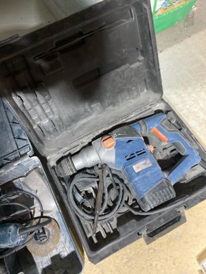 an open tool box with tools in it on the floor