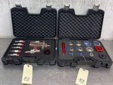 quelques outils dans une mallette posée sur une table