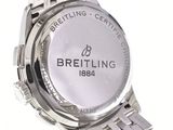 a close up of a watch on a white surface