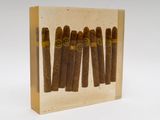 a box of five cigars sitting on top of a table