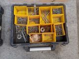 many different tools in a plastic box on the floor