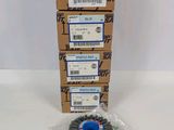 a box of three wheel brushes sitting on top of a table