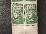 a pair of stamps with a woman ' s face on them