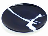a picture of a black and white plate with a bird on it