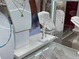 a display case with many different types of jewelry on it