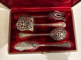 silverware in a red box with a red velvet lining on a table