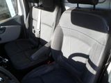 the interior of a car with two black seats and a steering wheel