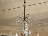 a chandelier hanging from the ceiling in a room