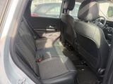 the back seats of a car are empty in a parking lot
