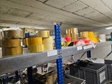 many rolls of tape on the shelves in the warehouse