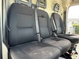 four seats in the back of a van that are empty