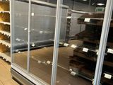 a large display case in a store filled with food