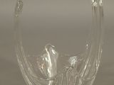 pair of clear glass vases sitting on top of a white surface
