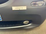 a close up of a car with a sticker on the front of it