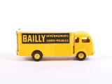 yellow and black toy truck with the word baily on it ' s side