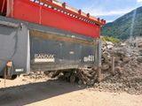 a large truck that is sitting in the dirt