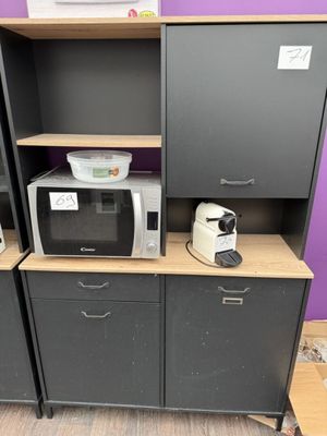 two microwaves and a microwave oven on a shelf
