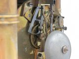 a close up of a clock that is on a table