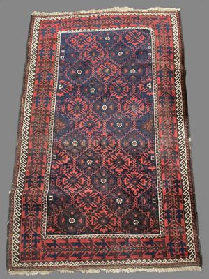 an antique persian rug with a blue and red design