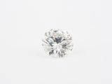 a round brilliant cut diamond in white gold
