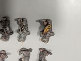 many pieces of metal that are on a white surface