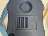 a close up of a plastic bag with a blue strap on it
