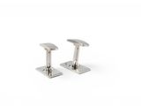 a pair of silver cufflinks on a white background