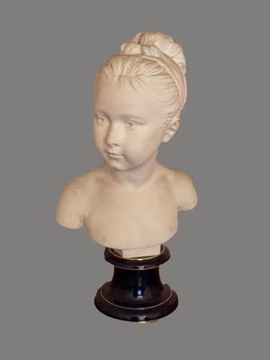 marble bust of a young girl with a bun on her head