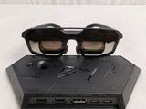 a pair of glasses sitting on top of a laptop