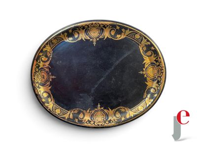 a black and gold plate on a white background