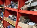 a red shelving with lots of tools on it