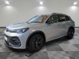 a silver 2021 alfa qx suv parked in a showroom